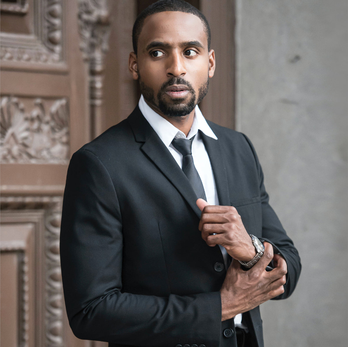 YND business campaign: a man wearing a black suit.