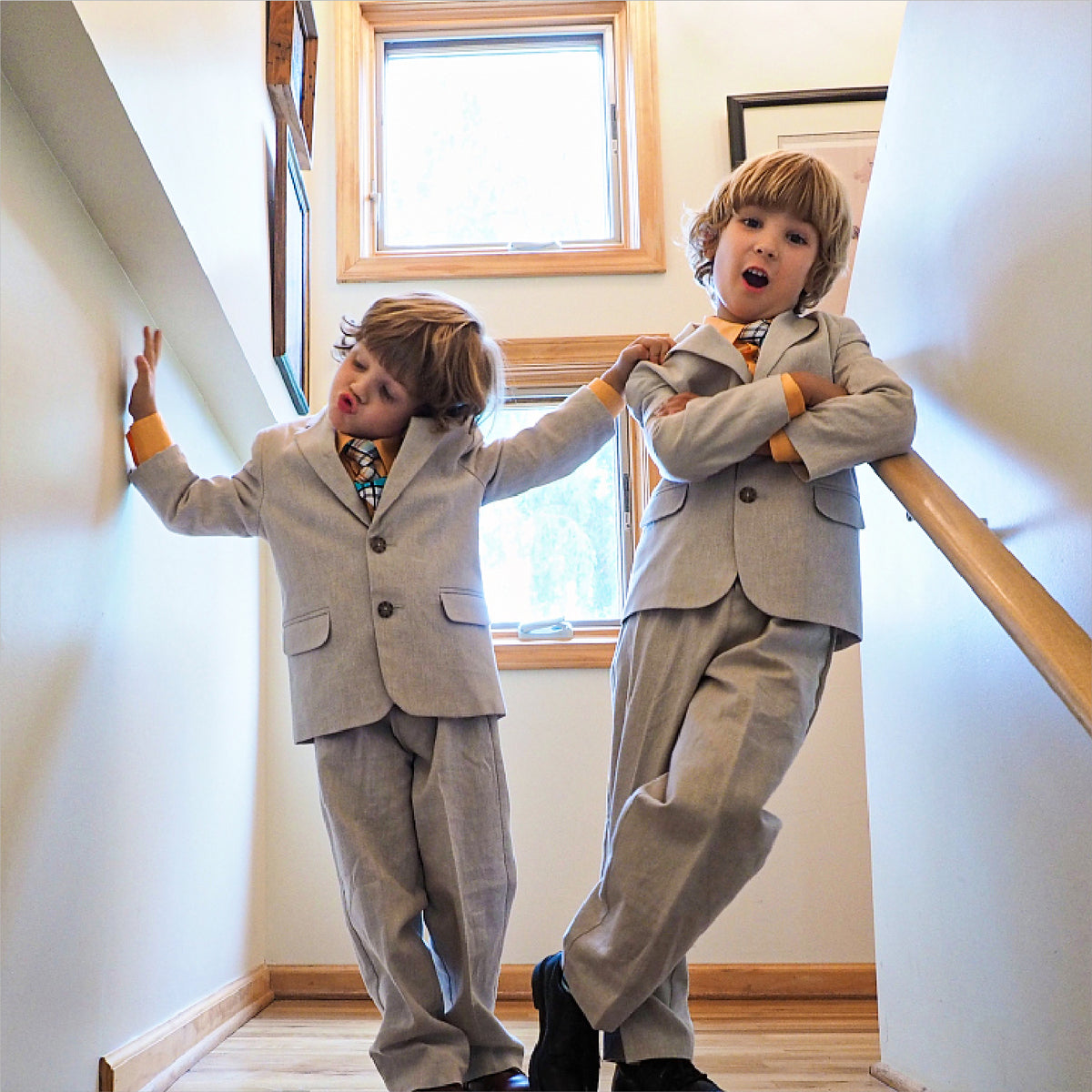 Two boys wearing light suits in the YND campaign.